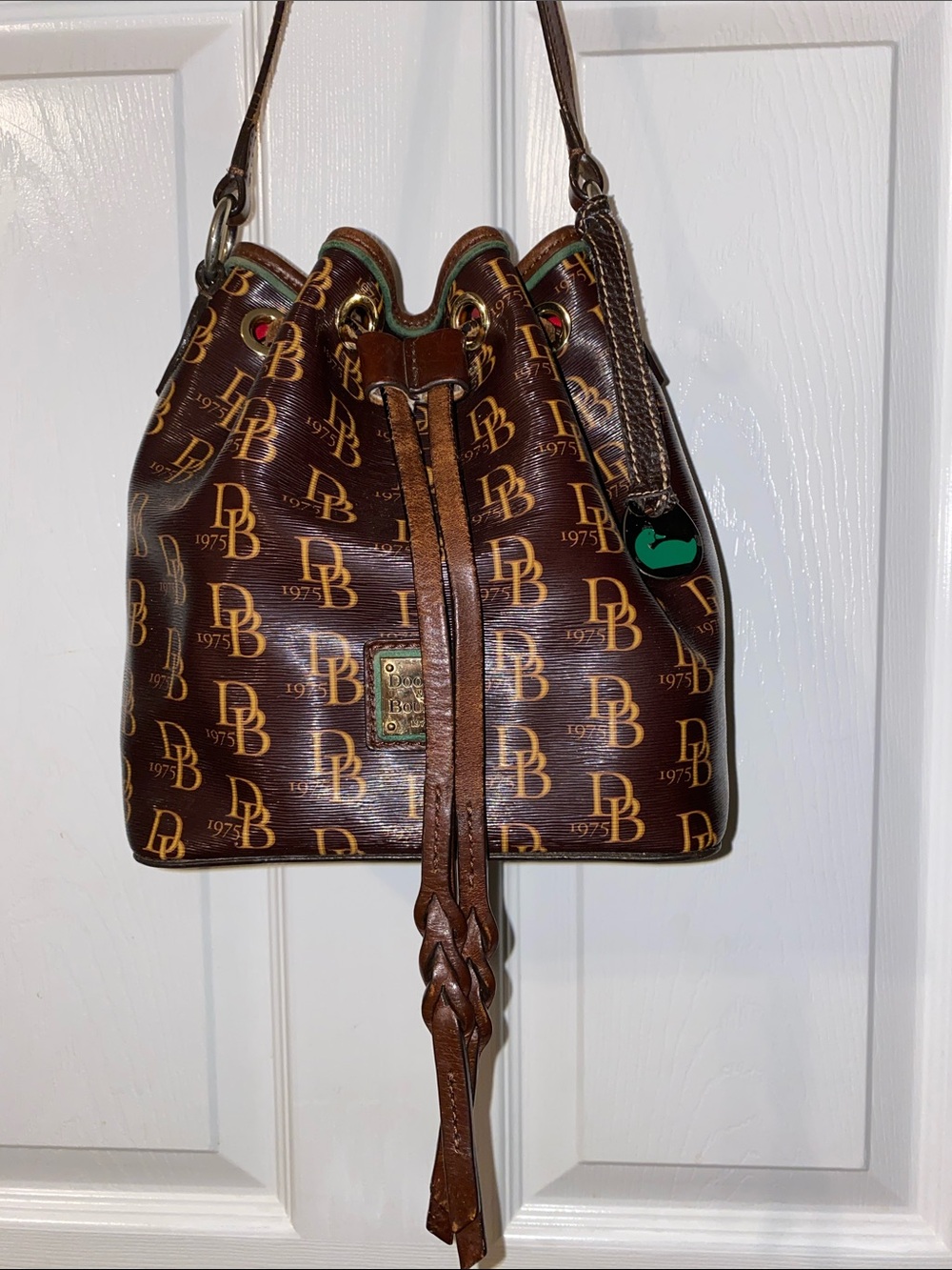 Dooney & Bourke Brown DB Monogram Braided Drawstring Bucket Bag - Picture 2 of 12
